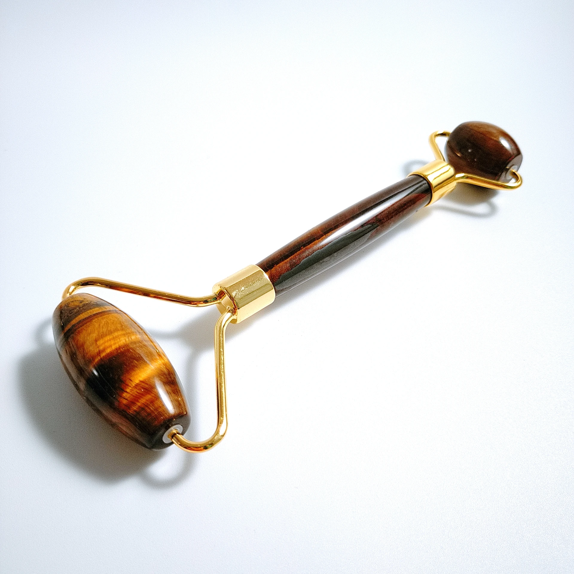 

Quartz facial roller. Tiger eye Skin massager. Facial roller