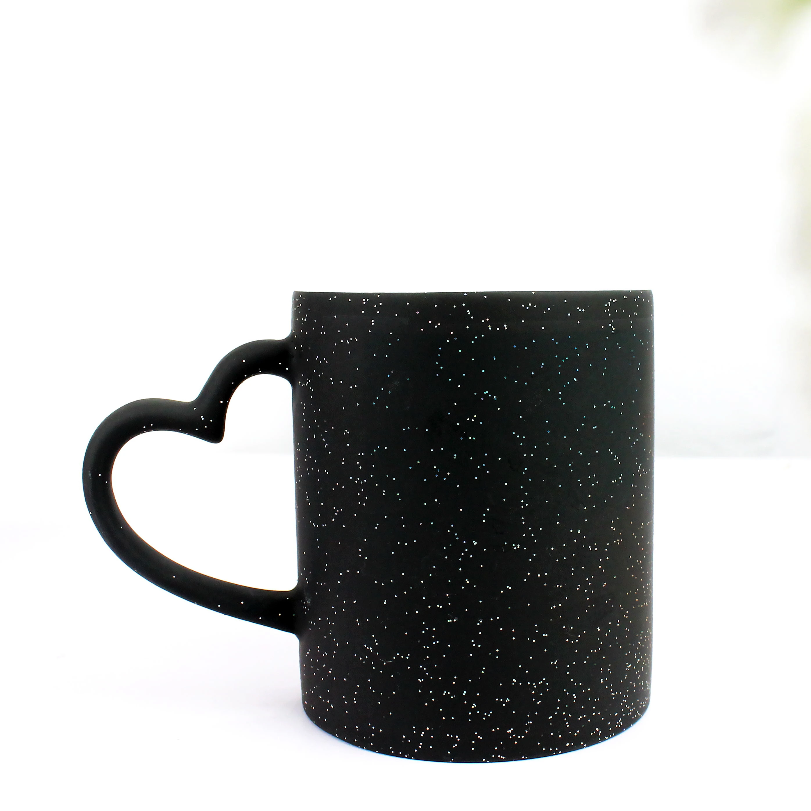 

Wholesale Custom 11oz Sublimation Ceramic Glitter Magic Mugs with Heart Shape Handle Blank Colour Changing Mug, Black