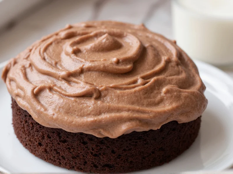 Chocolate whipped cream frosting on chocolate cake