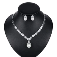 

Marquise Cut Cubic Zirconia Crystal and Imitation Shell Pearl Necklace and Earring Bridal Jewelry Set in Rhodium Silver