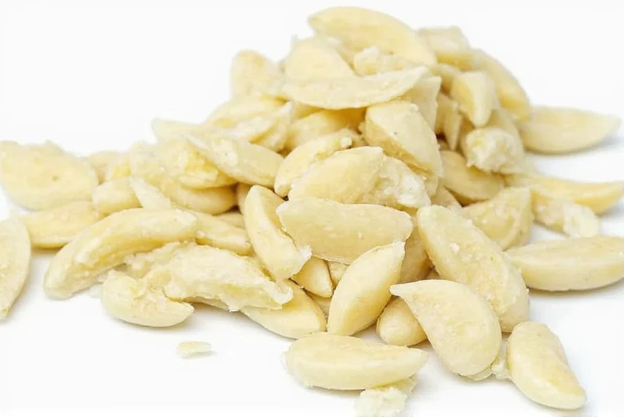 Chef measuring minced garlic for cooking