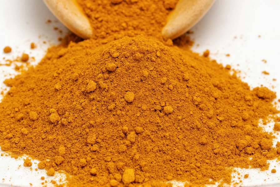 Variety of curry powder ingredients on wooden table