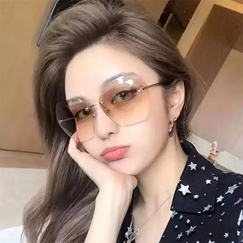 

China Factory 2021 Uv400 Oversized Ocean Lens Shades Sun Glasses Wholesale Women Female Lady Rimless Sunglass