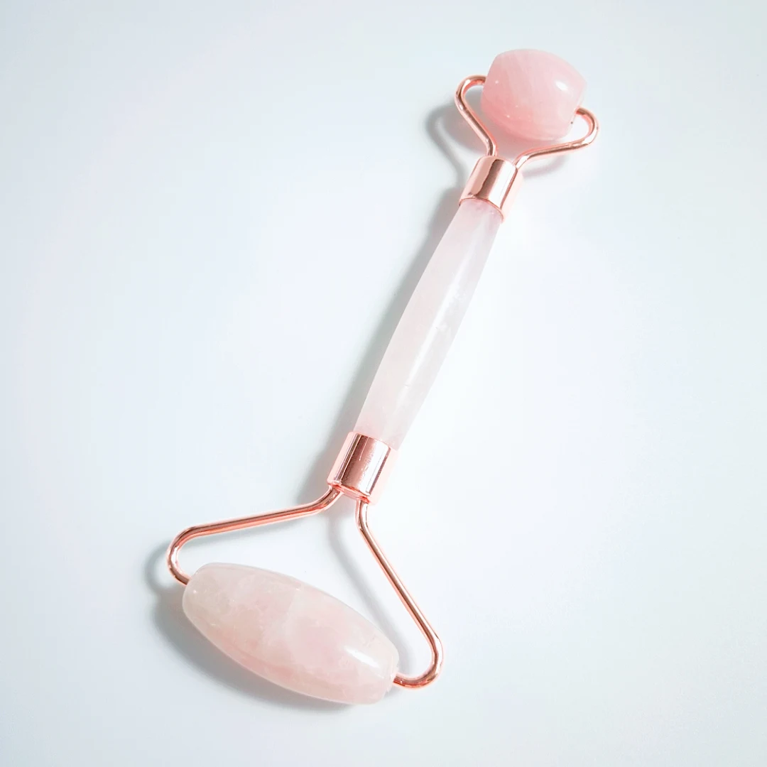 

Quartz facial roller. Rose quartz Skin massager. Facial roller