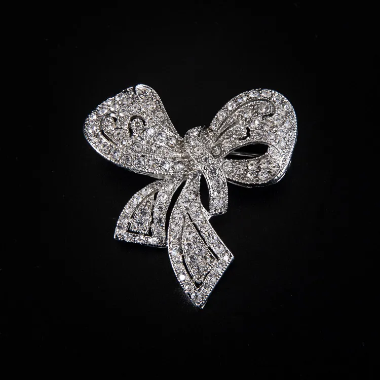 

Hollow out modern silver plated alloy white rhinestone bow tie shape dress brooch