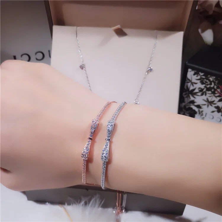 

Adjustable Pull Chain S925 Silver Micro Pave Cubic Zircon Bow Bracelet Dainty 925 Sterling Silver CZ Bowknot Shaped Bracelet