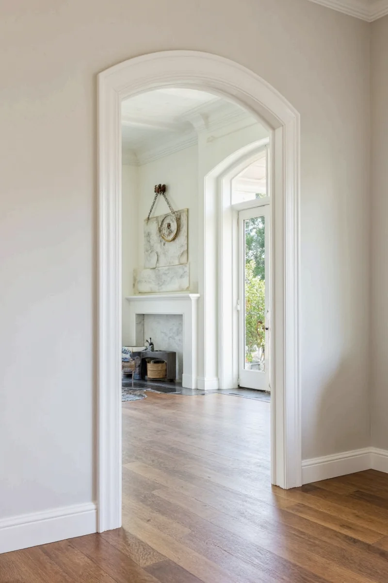 Holiday-themed room with decorated arched doorway