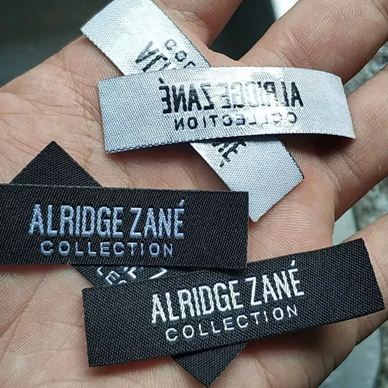 

1000pcs , 5.5 * 1.5 cm Custom Hot iron on Black cloth label Straight cut tags hot melt glue