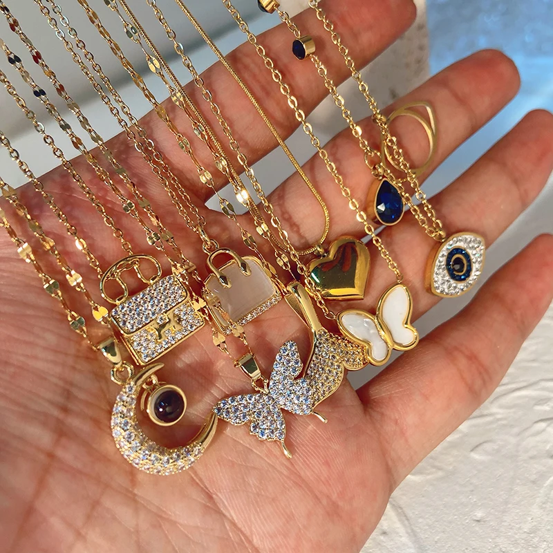 

TU-GEM Luxury 18K Gold plated Jewelry Stainless Steel Chain Chocker Gemstone Bag heart eyes Zircon Pendant Necklace For Women