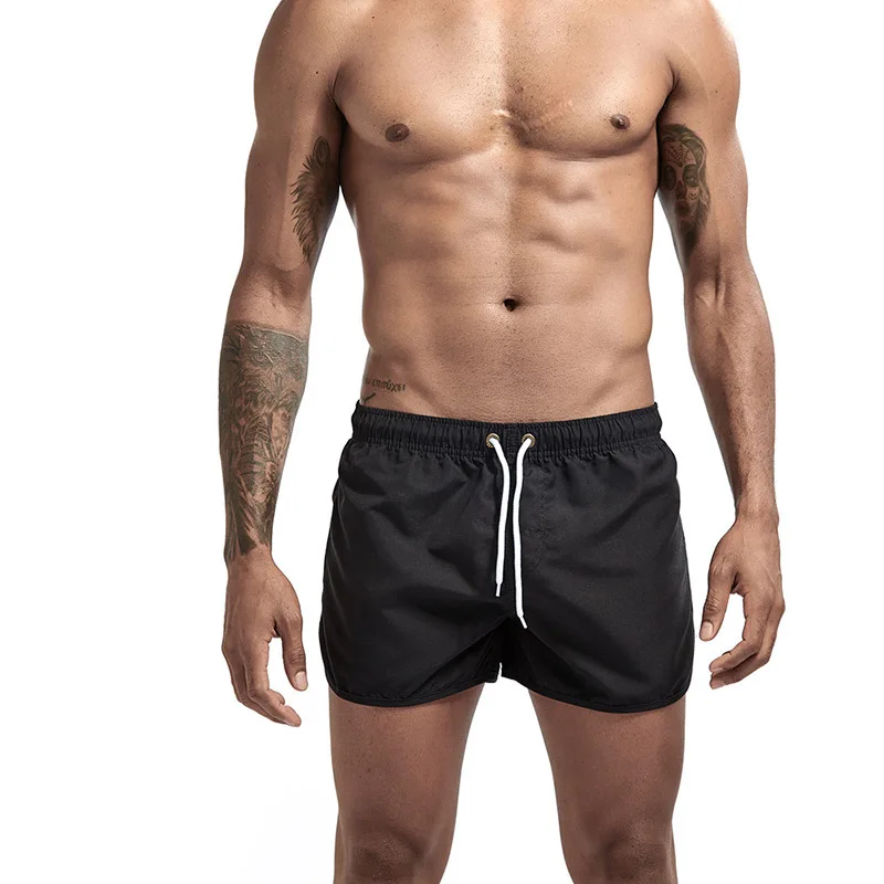 

Hot Sale Stock Solid White Black Blue Polyester Men Drawstring Quick Dry Surfing Swimming Beachwear Hot Pants Board Shorts, Any color