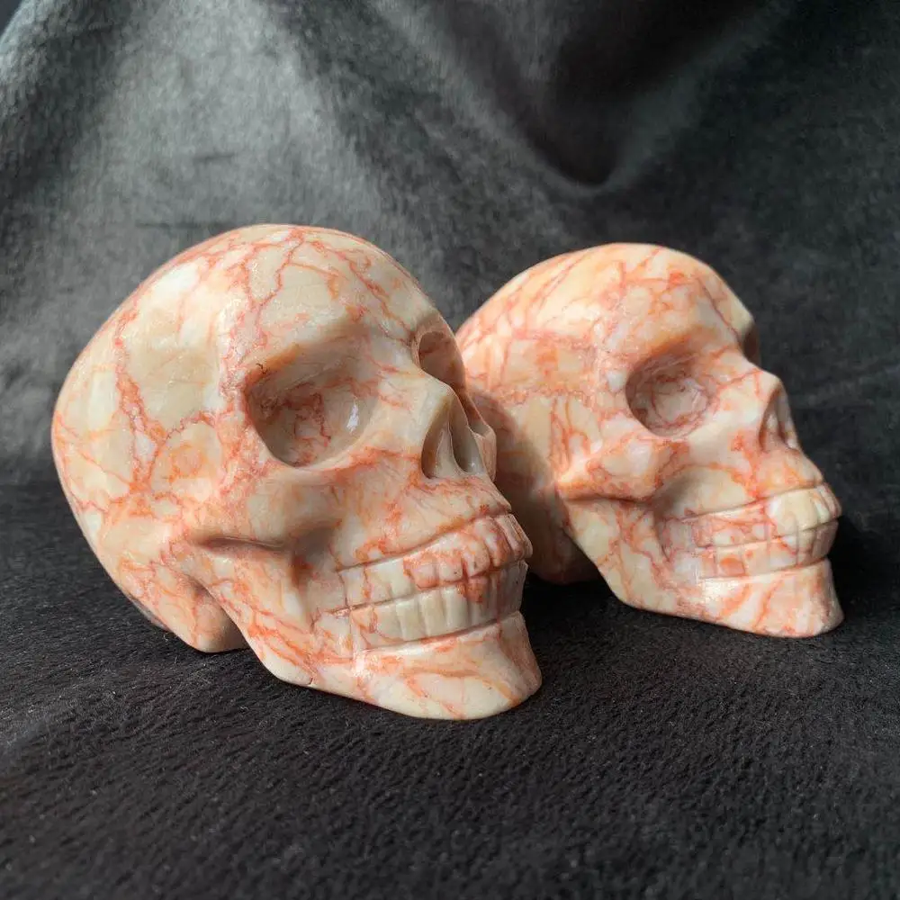 

Wholesale High Quality Natural Quartz Crystal Skulls Folk Crafts Red Vein Jasper Skulls For Feng Shui Decoration