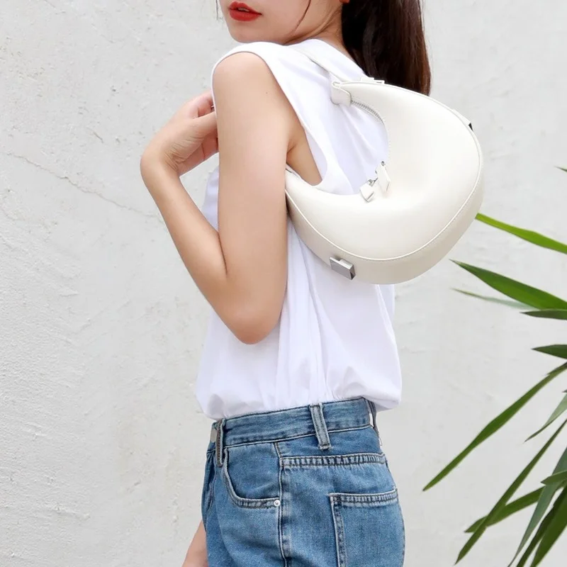 

Genuine Leather Bag New Niche Cowhide Crescent Ins Half-moon Shoulder Retractable Handbag