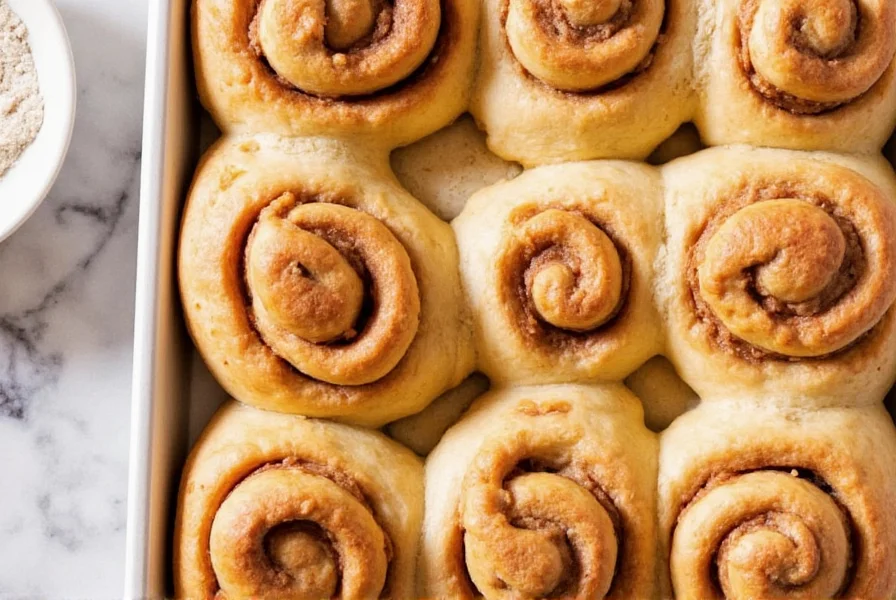 Step-by-step preparation of cinnamon roll dough being rolled out on floured surface with cinnamon sugar mixture