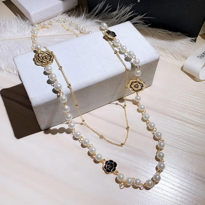 

New Personality and Fashion Luxury Hollow Camellia Pearl Pendant Flower Sweater Chain Necklace for Women, Picture shows