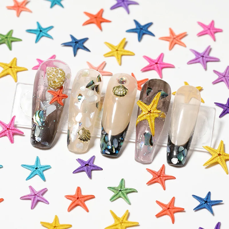 

Wholesale 2022 Summer natural starfish manicure jewelry new ocean style accessories 10pcs/box 3d nail art charm decoration, As shown in the figure