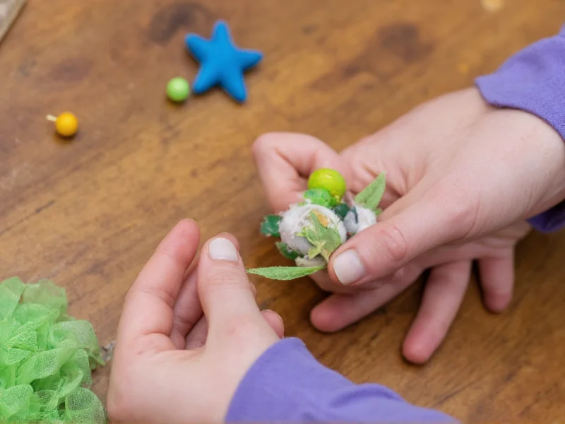 Hand holding sustainable crafting materials
