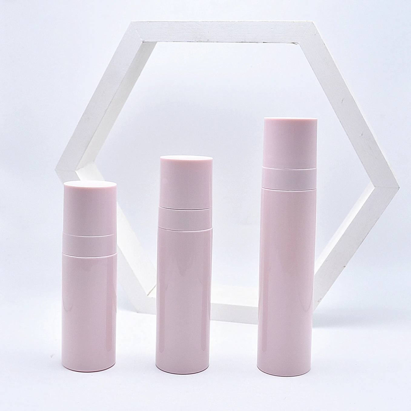 

60ml 80ml 100ml Skincare Sunscreen Pump Spray Bottle Empty Plastic Cosmetic Bottle Pink Round PET cosmetic bottle