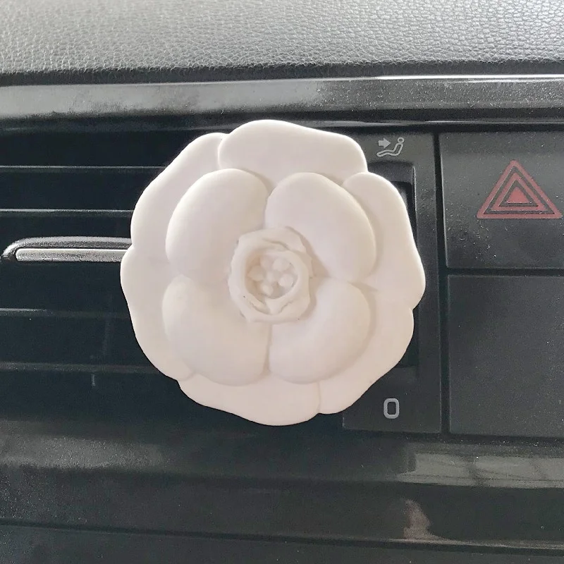 

Camellia Shaped Ceramic Aromatherapy Essential Oil Perfume Fragrance Diffuser Stone Car Vent Clip Outlet Air Freshener, White