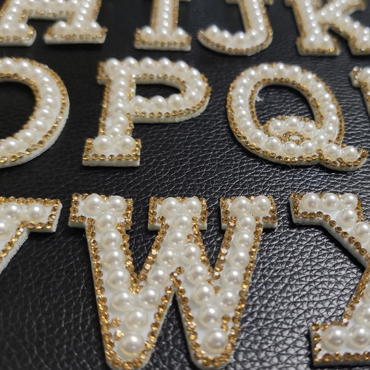 

Shenglan Golden Rhinestone Pearl Letters English Alphabet Patches Cloth Sticker Garment Accessories Back with Glue pearl patches, Picture