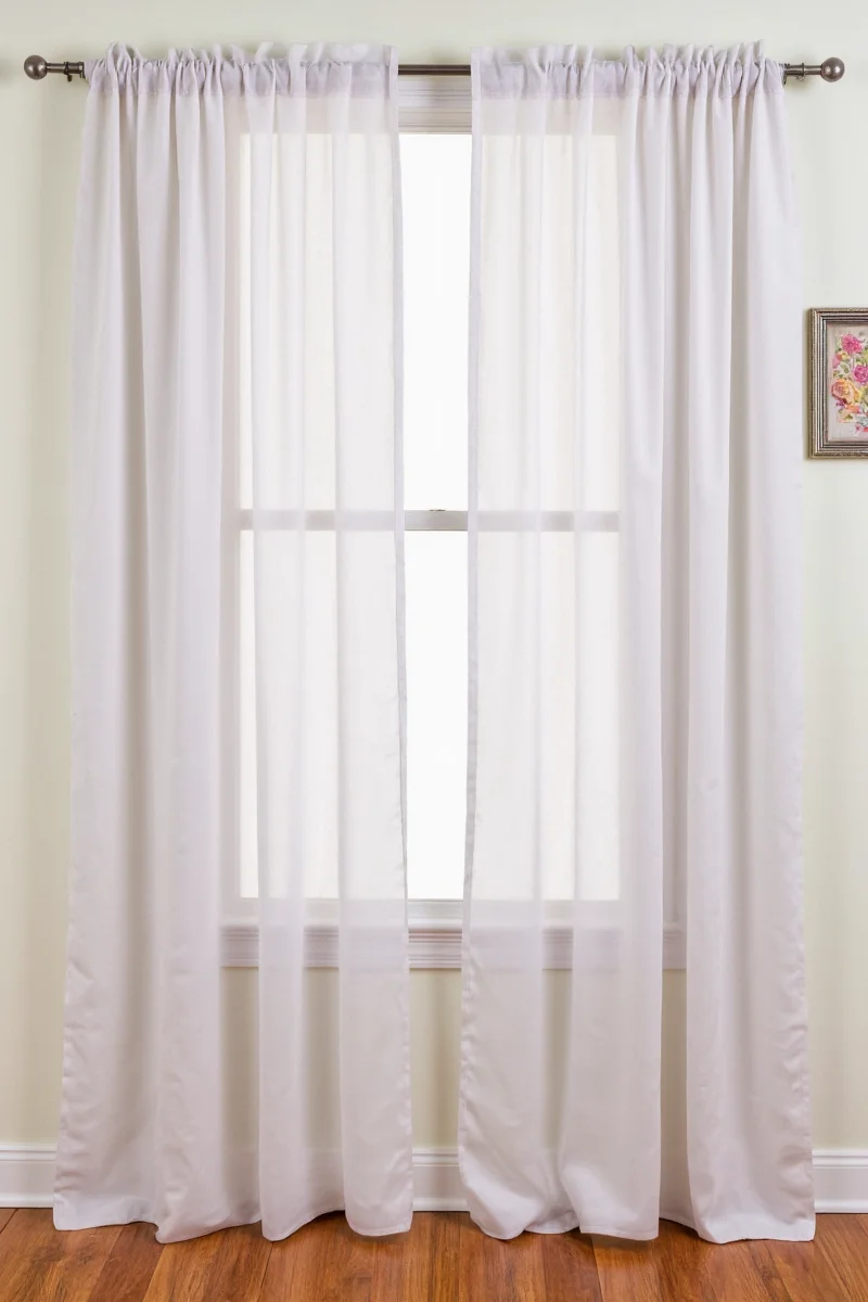 Happy family in living room with non permanent curtains