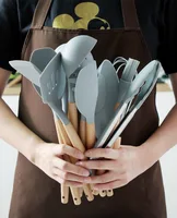 

Amazon 12 piece wooden handle silicone kitchenware set non stick pot spoon spatula colander kitchen utensils