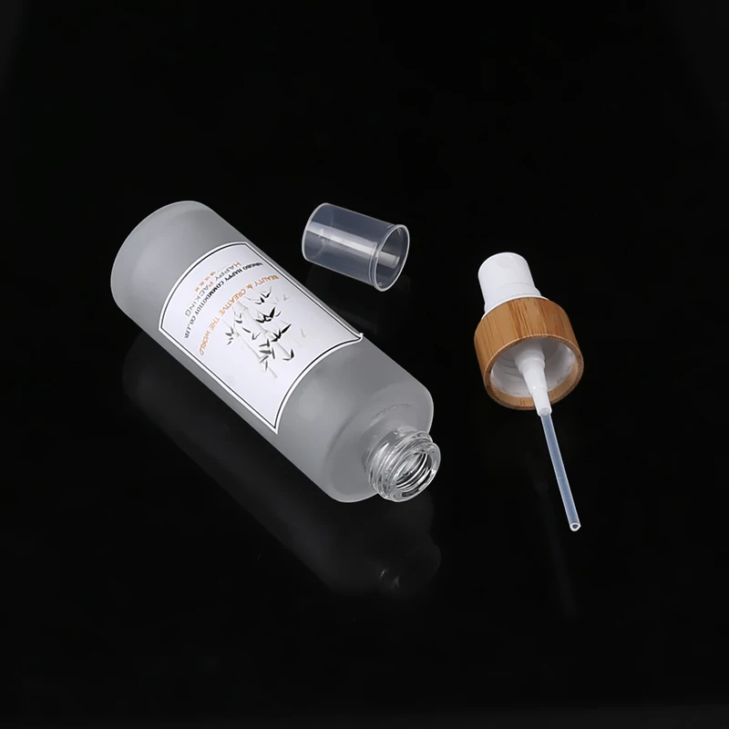 
100ml Cosmetic Glass Alcohol Bottles Glass Spray Bottle with Bamboo Pump Spray 