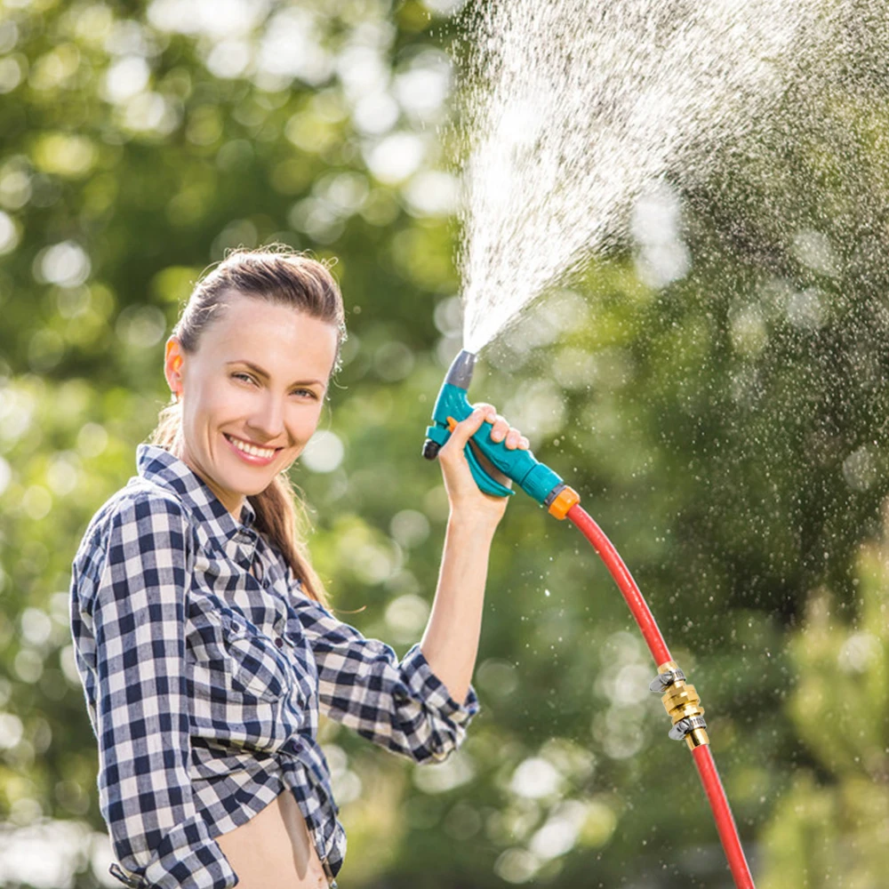 Watering flowers. Человек шланг. Девушка поливает из шланга. Поливаться из шланга. Человек поливает газон.