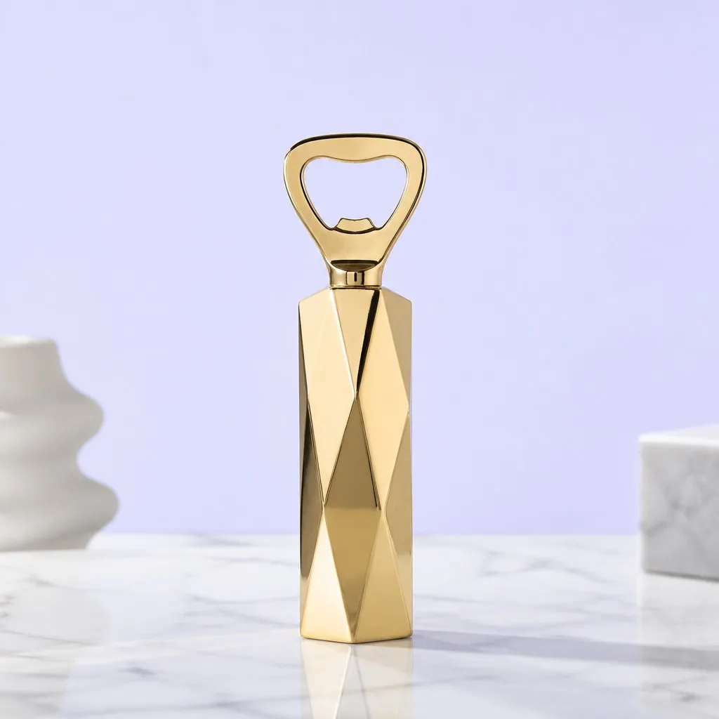 Faceted gold bottle opener on white marble with soft home styling
