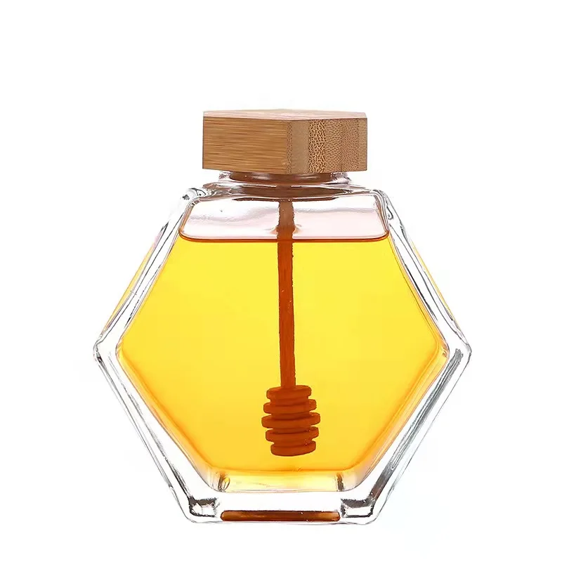 

Factory Price Customized Hexagon Glass Jam Jars Honey Glass Jar With Wooden Lid and Dipper, Transparent