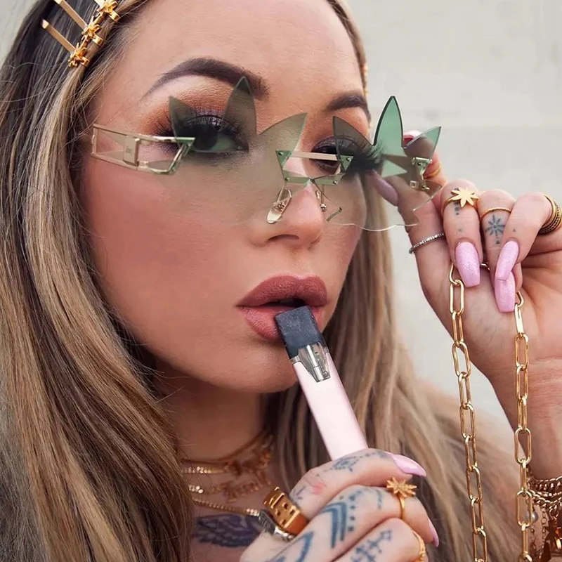 

Punk Women Gradient Sun Glasses Metal Fire Leaf Shaped Party Funny Rimless Sunglasses 2021
