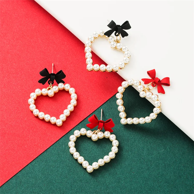 

Alloy spray-painted bowknot love heart-shaped imitation pearl earrings woman European and American earrings Christmas jewelry, 2 colors