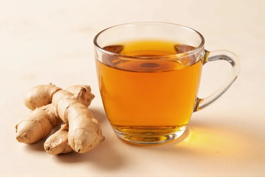 Fresh ginger root and brewed ginger tea in a ceramic mug