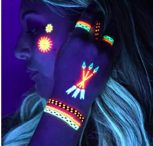 

Daytime and Blacklight Colored UV Tattoos Glow In The Dark