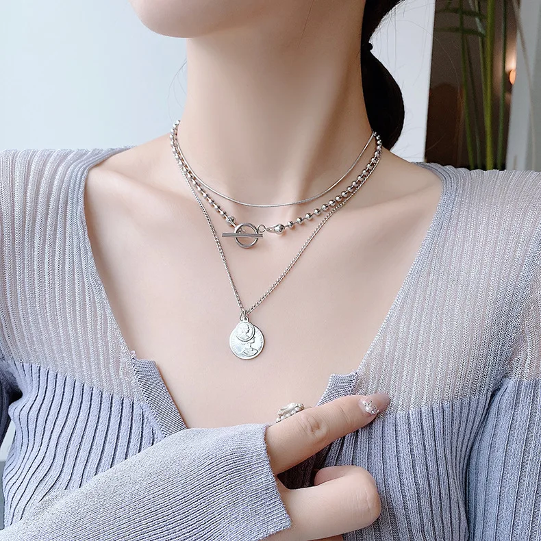 

Champagne gold Queen gold coin head necklace