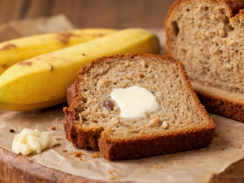 Sliced banana nut bread with butter melting on warm slice