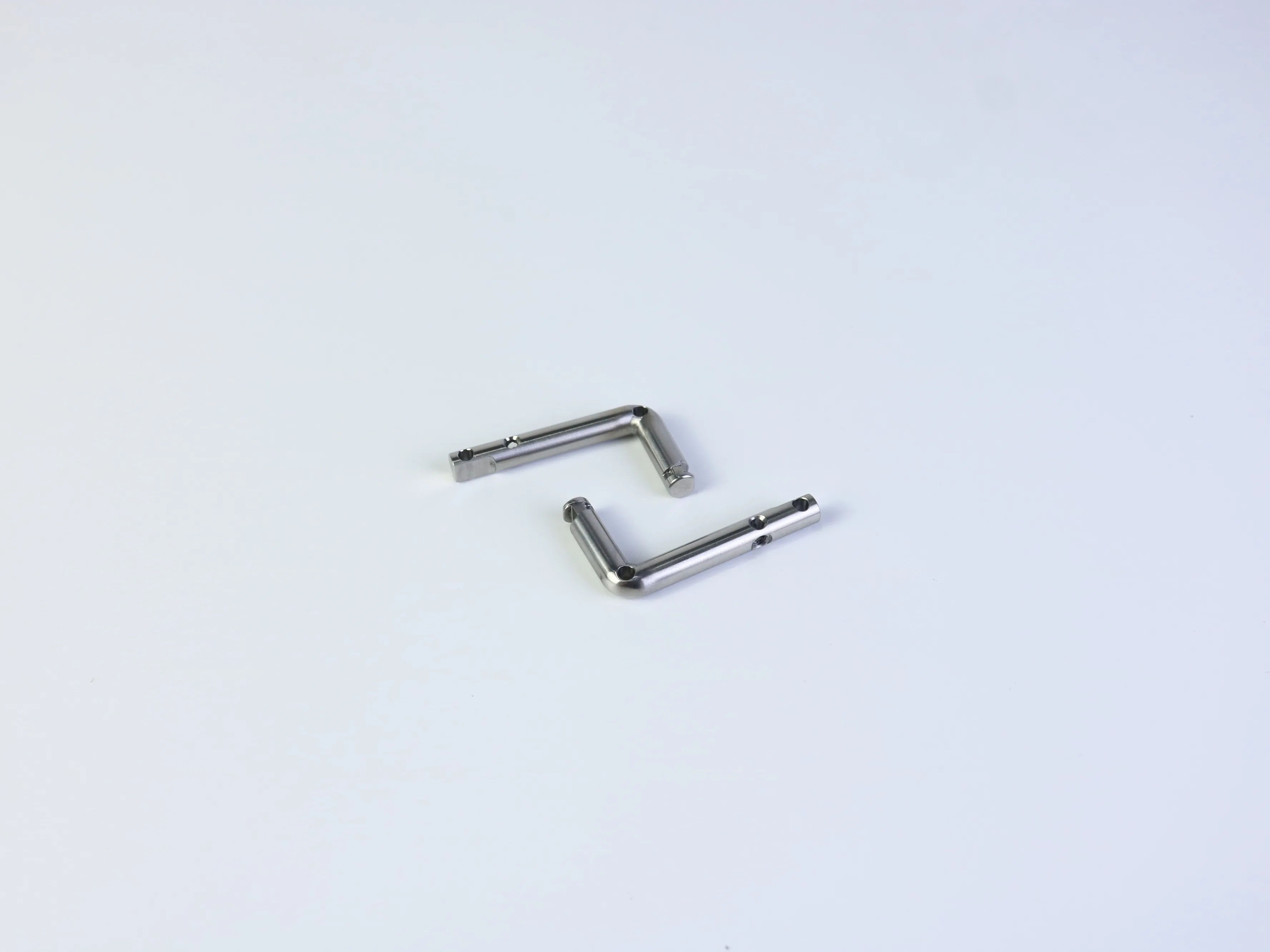 Two views of welded stainless steel components