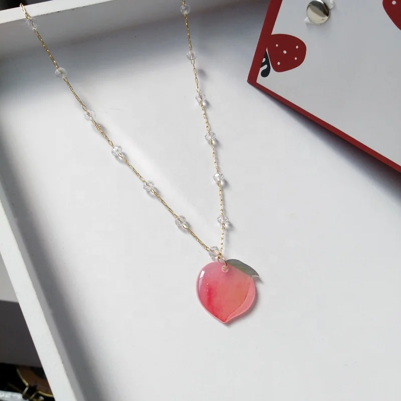 

QIANZUYIN Hot Sale Factory 18K Gold Plated Resin Fruit Pendant Jewelry Charm Crystal Peach Earrings Peach Necklace, Picture