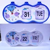 capsule cylindrical button press flip day and date table manual alarm clock