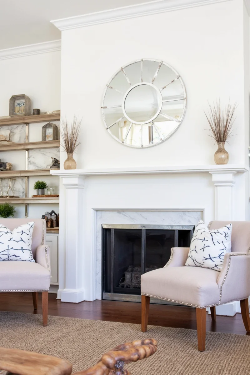 Magnetic clips used to display photos and art on a painted mantel