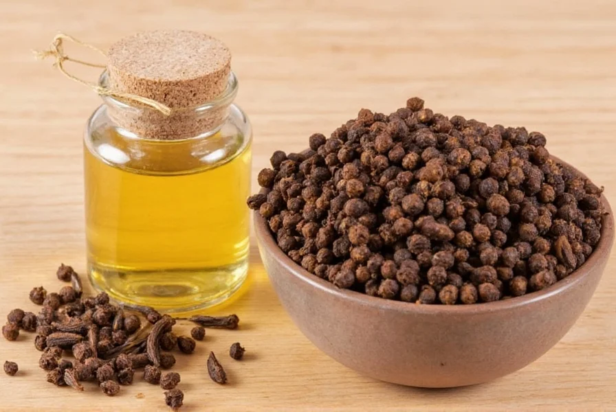 Glass jar with cloves steeping in oil for homemade clove oil preparation