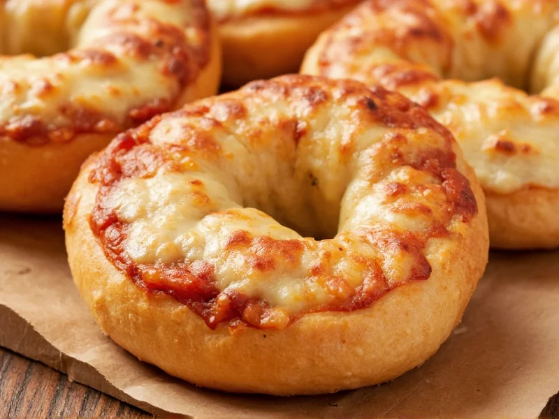 Crispy golden pizza bagel halves with melted cheese
