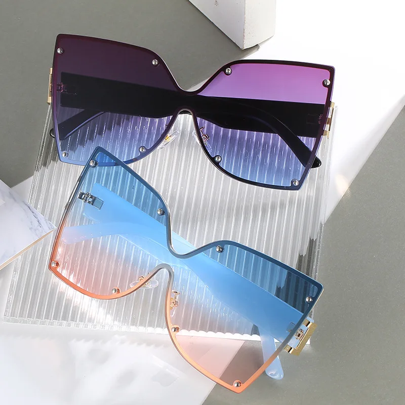 

DCOPTICAL 2021 Women Fashion Glasses Butterfly Bowknot One Piece Shape Rimless Metal Temple Sunglasses Unisex