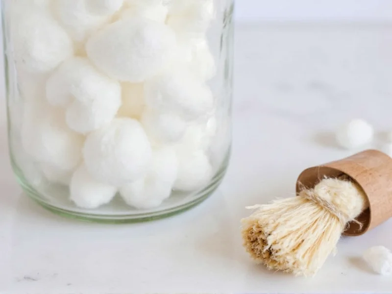 DIY diffuser materials in mason jar with cotton balls