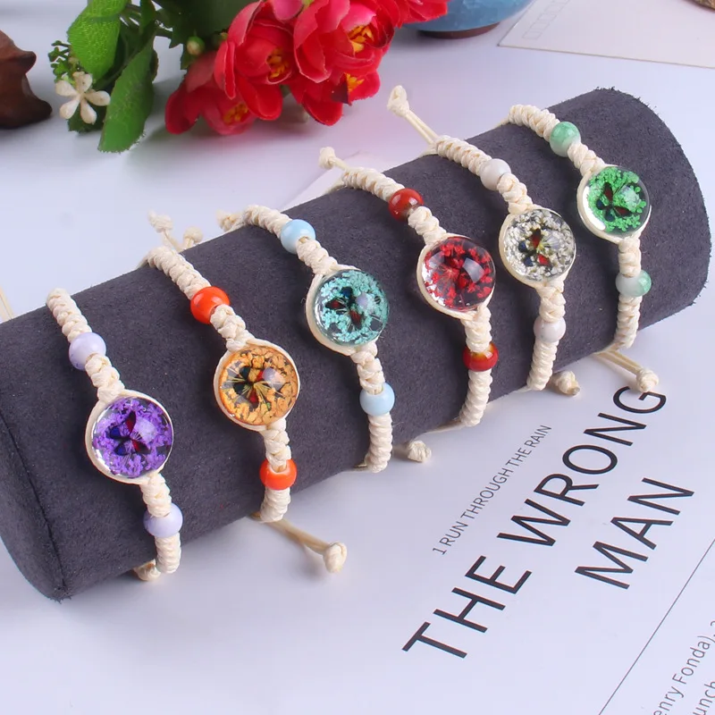 

Wholesale Fashion Colourful Glass Bead Dried Flower Butterfly Handmade Braided Rope Bracelet Beaded Bracelets Charms For Women