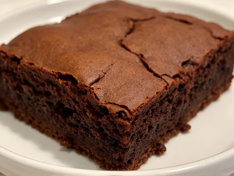 Close-up of fudgy homemade brownie with crackly top