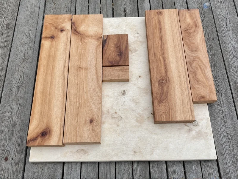 Reclaimed wood pieces sorted for DIY entertainment center build