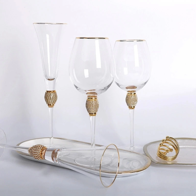 

New arrivals hot sale in stock elegant sparkling studded Long stem crystal glassware set with gold rim and dazzling rhinestone, Customized color