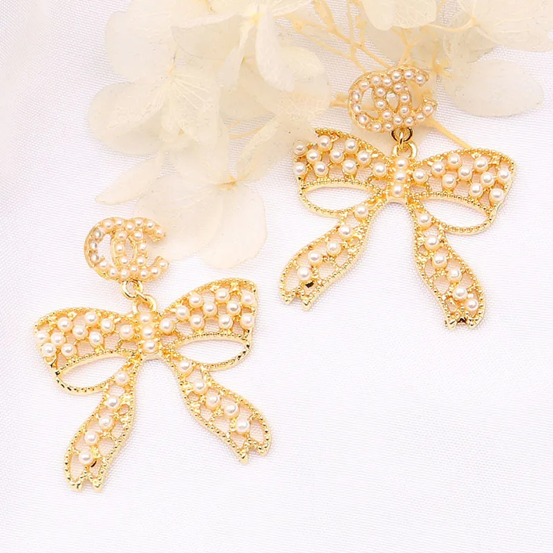 

New Fashion 925 Silver Needle Earrings All-match Women's Letter double C Earrings Bow Pearl Earrings gift, Picture shows