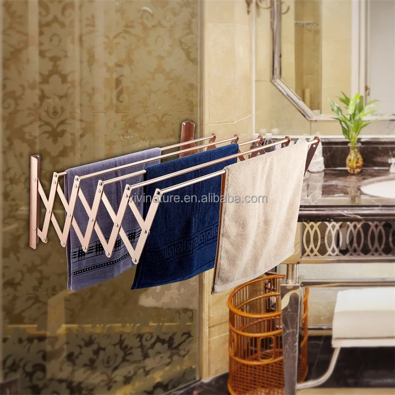 

Wall mounted telescopic towel hanger and clothes rack