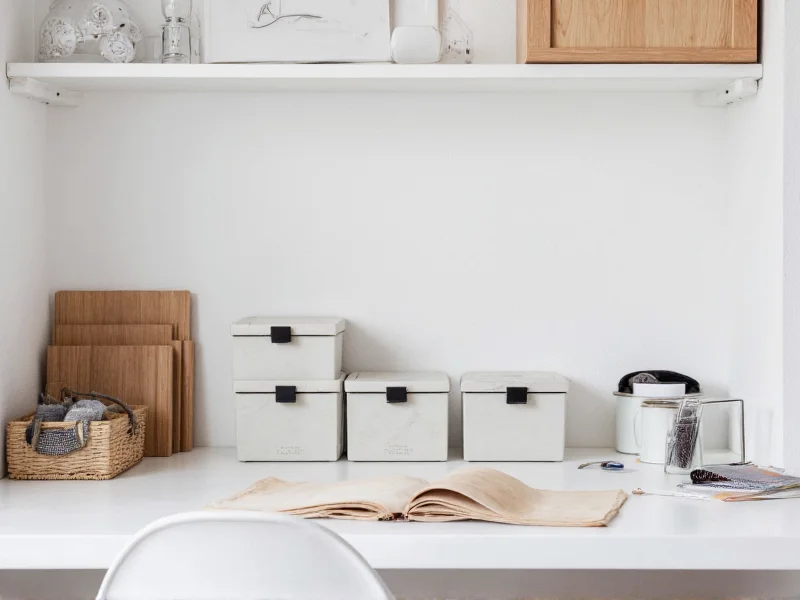 Minimalist craft haus workspace with labeled storage bins